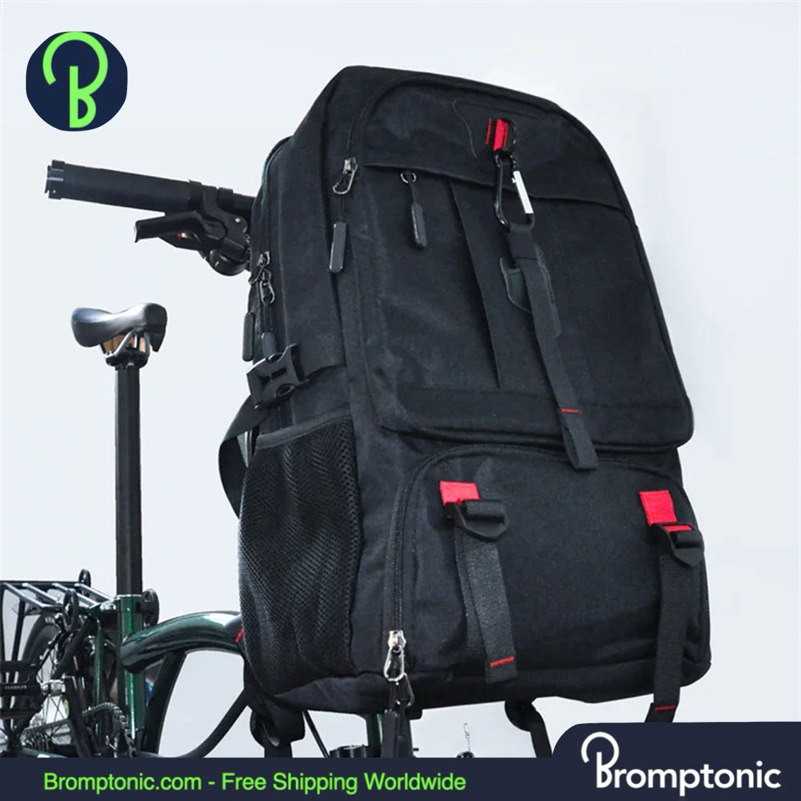 A large black Brompton-compatible trekking backpack with red accents, featuring multiple compartments and shoulder straps, displayed on a bicycle.