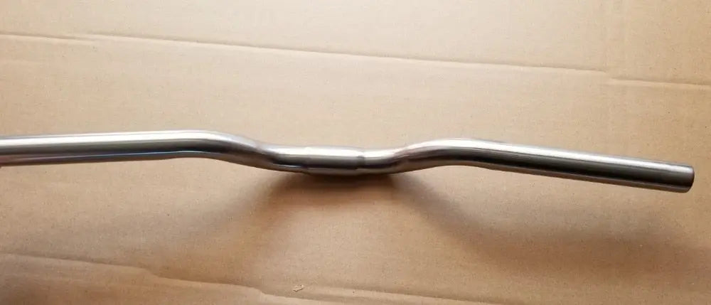 Titanium outlet riser bar